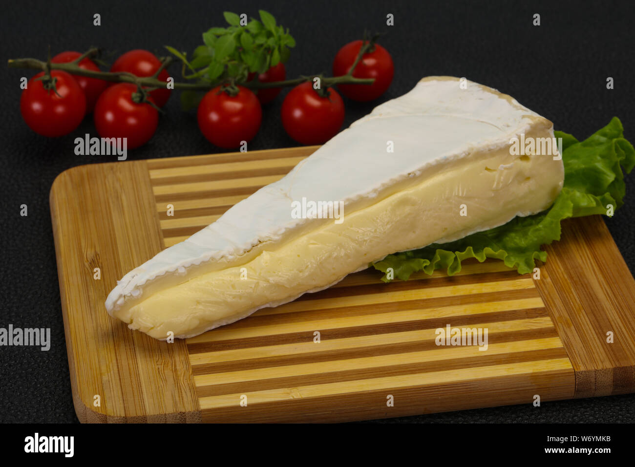 Brie cheese triangle served salad leaves Stock Photo Alamy
