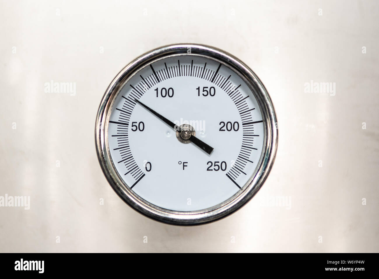 Temperature reading dial indicates that all machinery being monitored is maintaining a safe level. Stock Photo