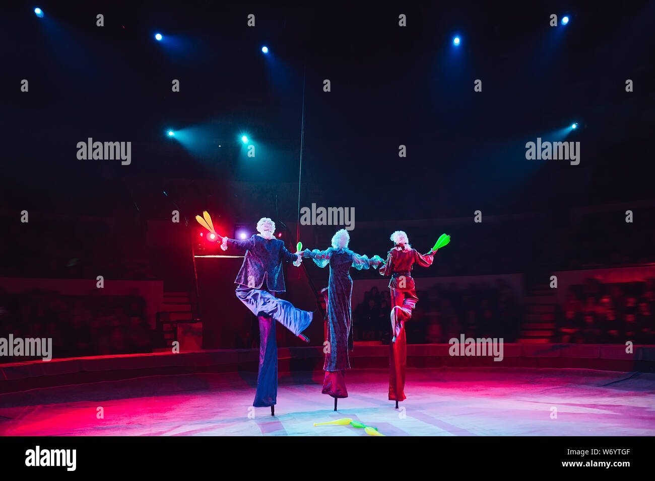 The performance of stiltwalkers in the circus Stock Photo Alamy