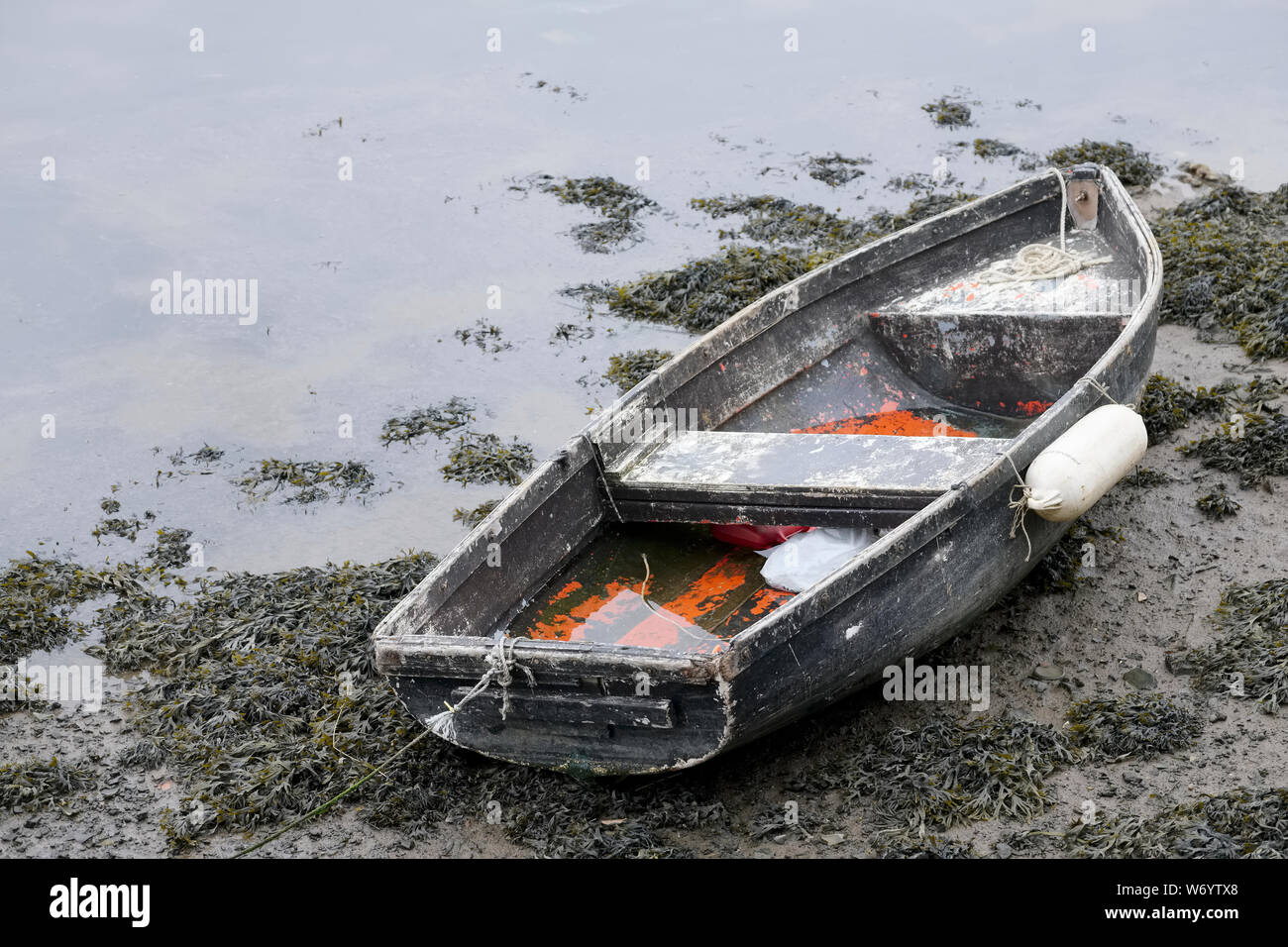Rustic old boat red wooden moored at harbour Stock Photo - Alamy