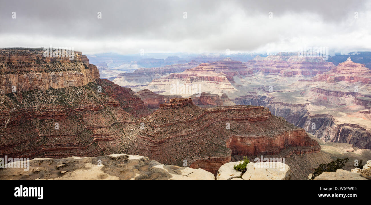 Grand Canyon National park, Arizona, United States. Panoramic overlook of the red rocks, cloudy sky background Stock Photo