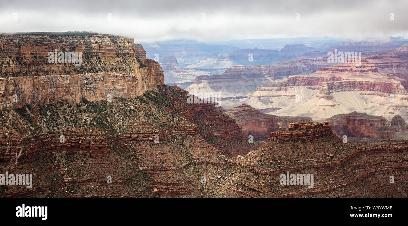 Grand Canyon National park, Arizona, United States. Panoramic overlook of the red rocks, cloudy sky background Stock Photo