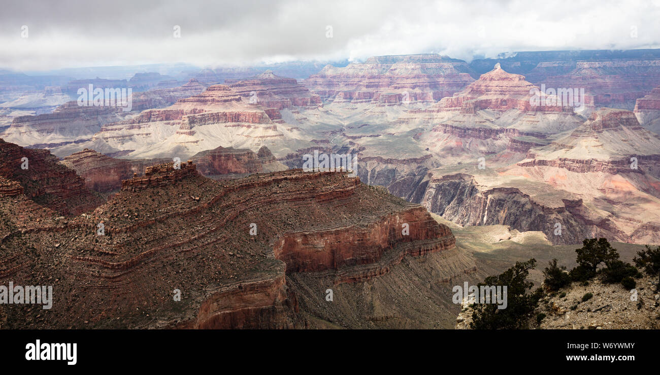 Grand Canyon National park, Arizona, United States. Panoramic overlook of the red rocks, cloudy sky background Stock Photo