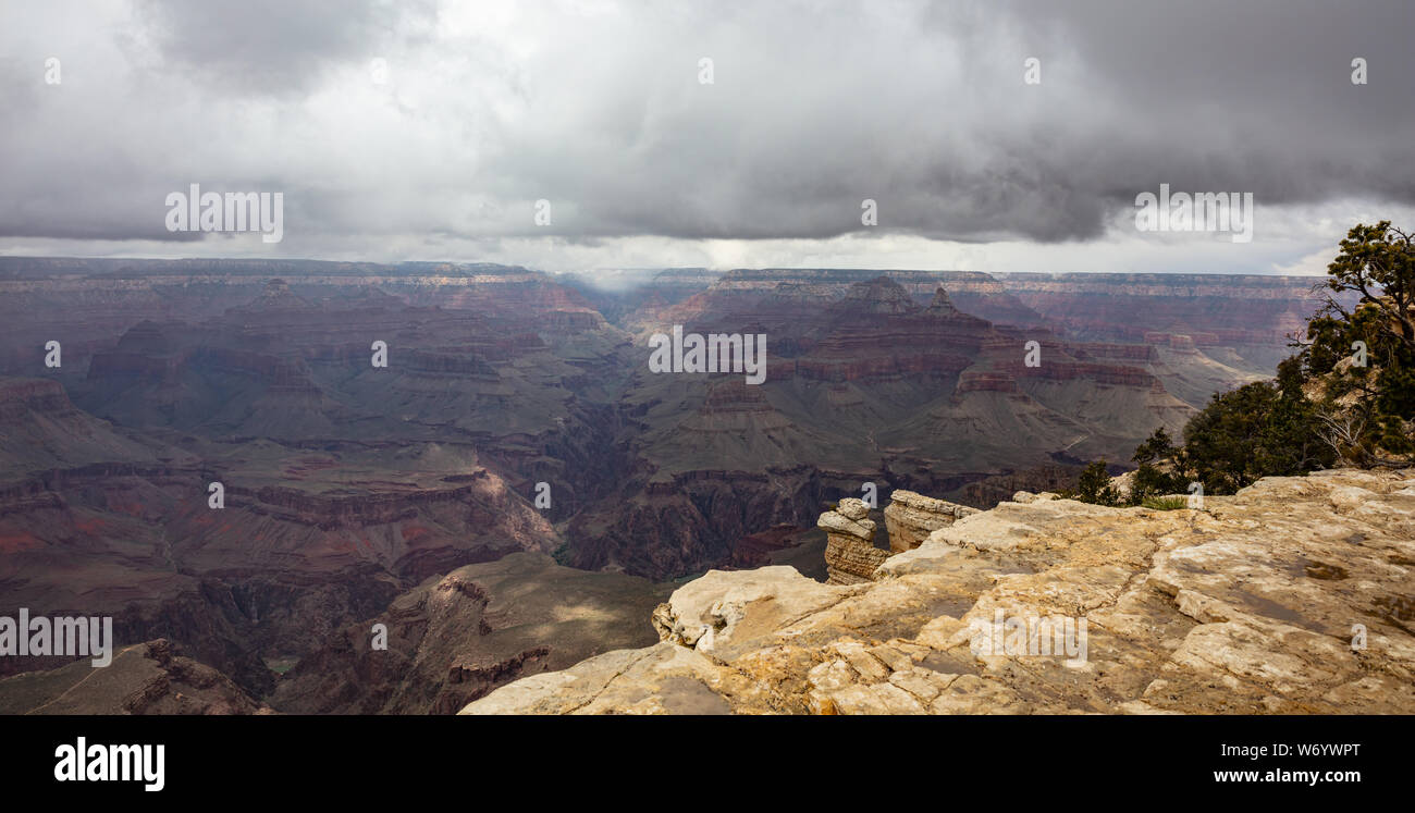 Grand Canyon National park, Arizona, United States. Panoramic overlook of the red rocks, cloudy sky background Stock Photo