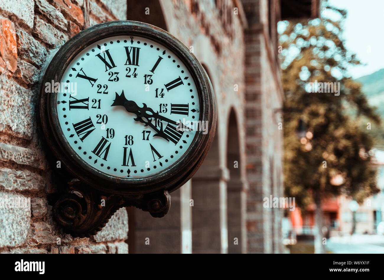 Old retro wall clock at a train station Stock Photo