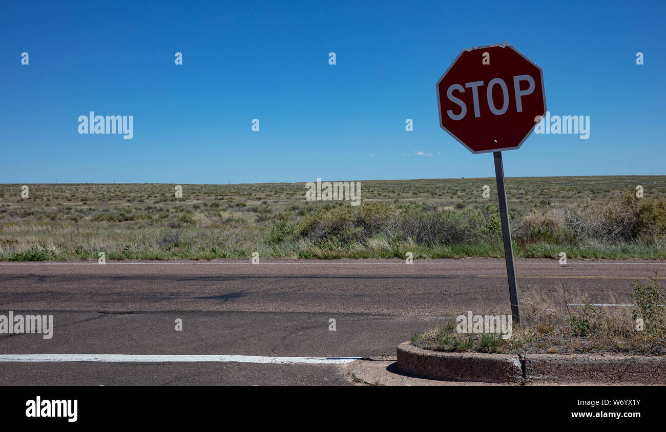 Stop road sign, desert landscape. Sunny spring day in western USA countryside, copy space. Stock Photo