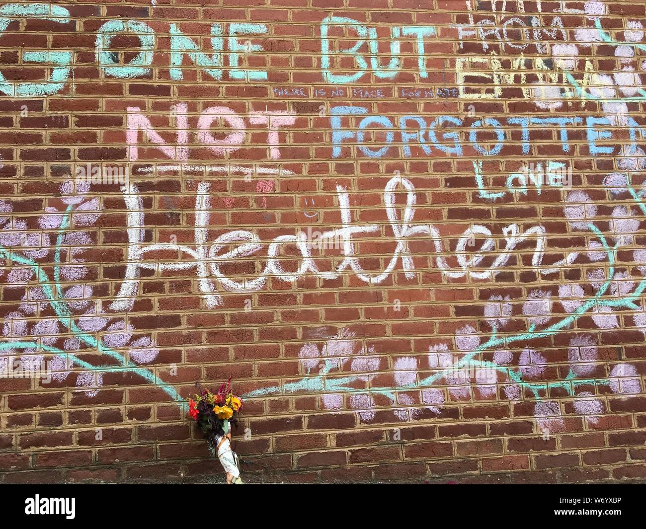 Flowers and chalk memorial to Heather Heyer, at the spot where she was killed by a white supremacist in Charlottesville, VA. Stock Photo