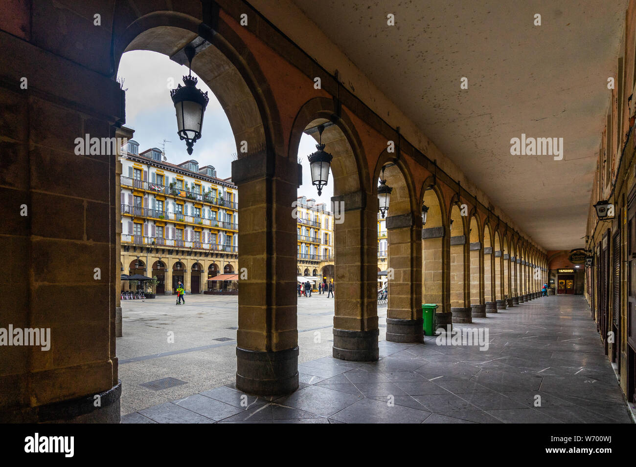 Under the arcade of Plaza de la Constitucion, the main square of San ...