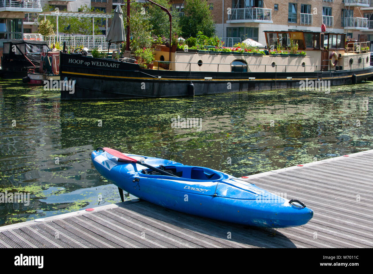kayak and barge on Brentford Canal London Stock Photo Alamy