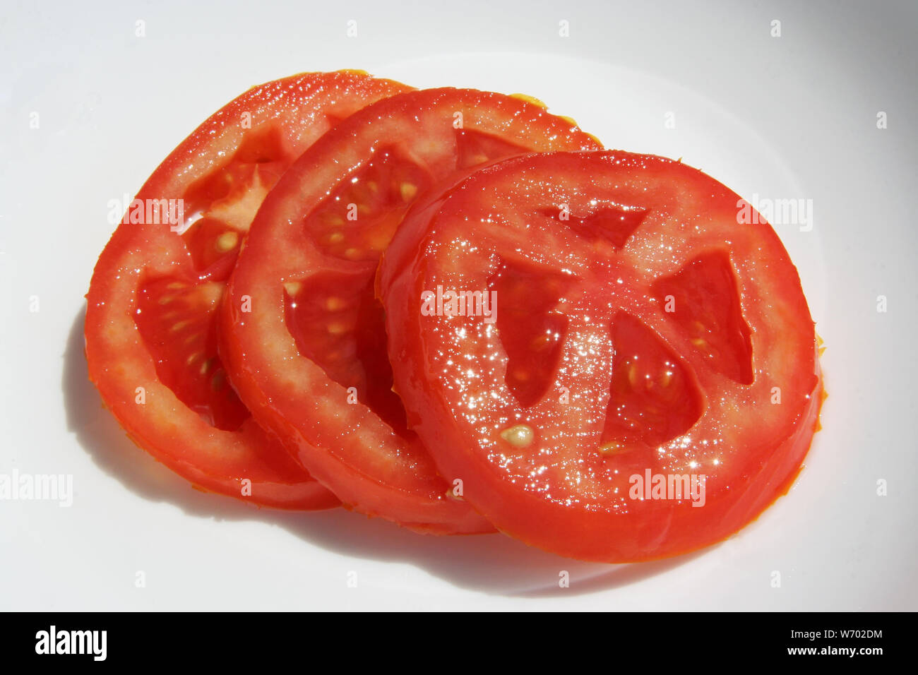 Tomato Rings Sliced tomatoes. Tomato rings. Tomato slices. Fresh tomato sliced into ...