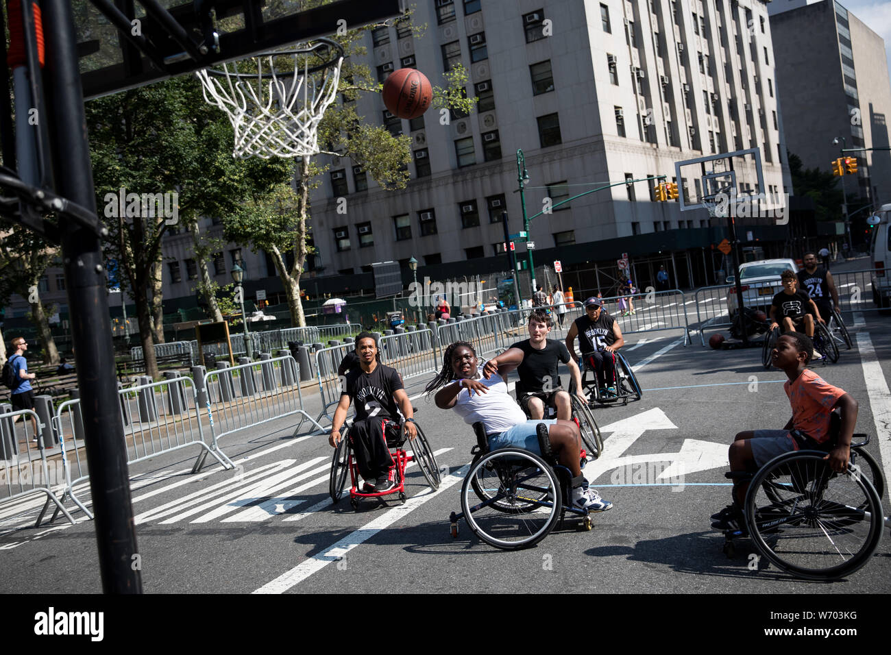 New York, USA. 3rd Aug, 2019. People in wheelchairs play basketball during  the 2019 Summer Streets event in New York, the United States, Aug. 3, 2019.  On the first three Saturdays in