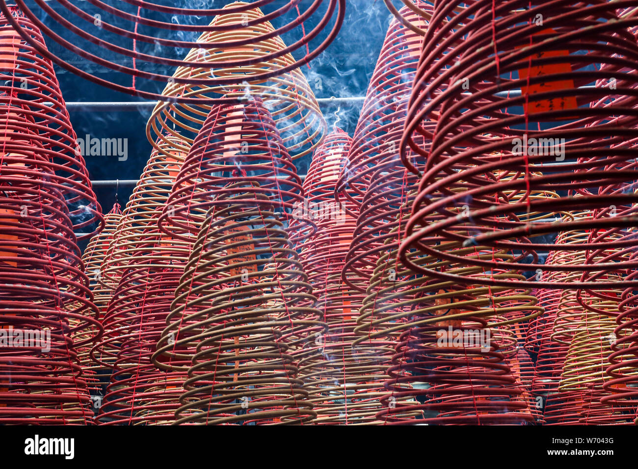 Suspended spiral incense sticks burning in Tin Hau Temple, Hong Kong Stock Photo