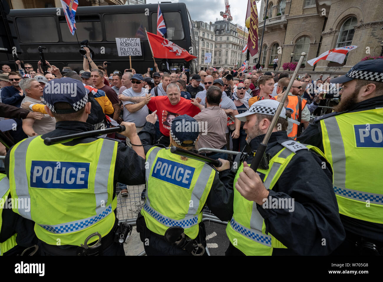 London, UK. 3rd August, 2019. 'Free Tommy Robinson' protest. Police arrest twenty four during a mass demonstration in support of the jailed Tommy Robinson, real name Stephen Yaxley-Lennon, who was sentenced last month to nine months in prison after being found guilty in contempt of court. Counter-protesters including antifascist activists and the anti-racist group: Stand Up to Racism, opposed the pro-Robinson demonstrators with protest groups kept apart by met police with some clashes. Credit: Guy Corbishley/Alamy Live News Stock Photo