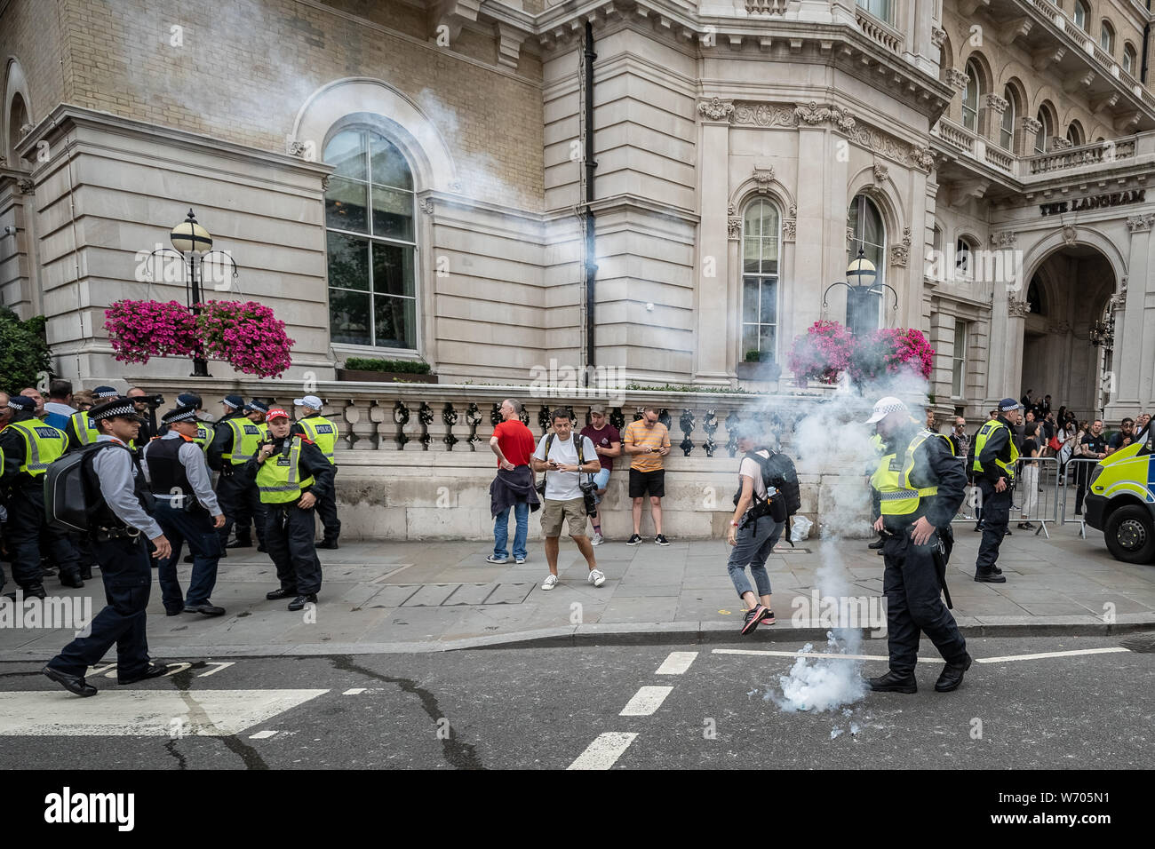 London, UK. 3rd August, 2019. 'Free Tommy Robinson' protest. Police arrest twenty four during a mass demonstration in support of the jailed Tommy Robinson, real name Stephen Yaxley-Lennon, who was sentenced last month to nine months in prison after being found guilty in contempt of court. Counter-protesters including antifascist activists and the anti-racist group: Stand Up to Racism, opposed the pro-Robinson demonstrators with protest groups kept apart by met police with some clashes. Credit: Guy Corbishley/Alamy Live News Stock Photo