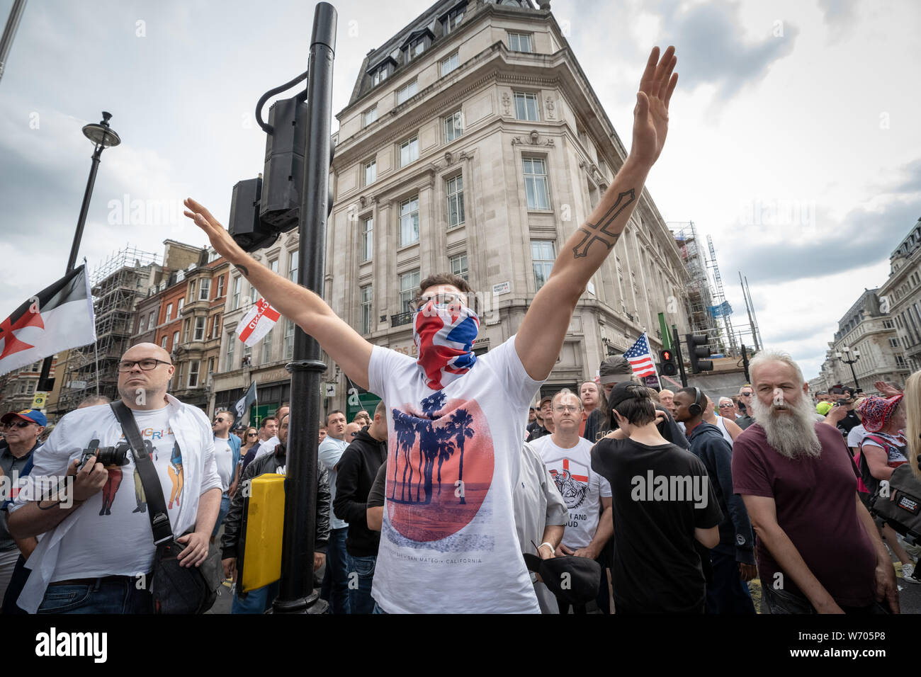 London, UK. 3rd August, 2019. 'Free Tommy Robinson' protest. Police arrest twenty four during a mass demonstration in support of the jailed Tommy Robinson, real name Stephen Yaxley-Lennon, who was sentenced last month to nine months in prison after being found guilty in contempt of court. Counter-protesters including antifascist activists and the anti-racist group: Stand Up to Racism, opposed the pro-Robinson demonstrators with protest groups kept apart by met police with some clashes. Credit: Guy Corbishley/Alamy Live News Stock Photo