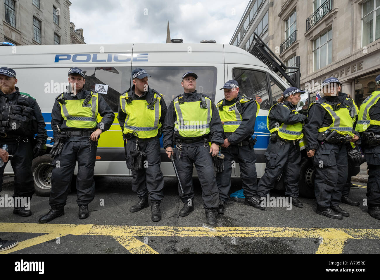 London, UK. 3rd August, 2019. 'Free Tommy Robinson' protest. Police arrest twenty four during a mass demonstration in support of the jailed Tommy Robinson, real name Stephen Yaxley-Lennon, who was sentenced last month to nine months in prison after being found guilty in contempt of court. Counter-protesters including antifascist activists and the anti-racist group: Stand Up to Racism, opposed the pro-Robinson demonstrators with protest groups kept apart by met police with some clashes. Credit: Guy Corbishley/Alamy Live News Stock Photo