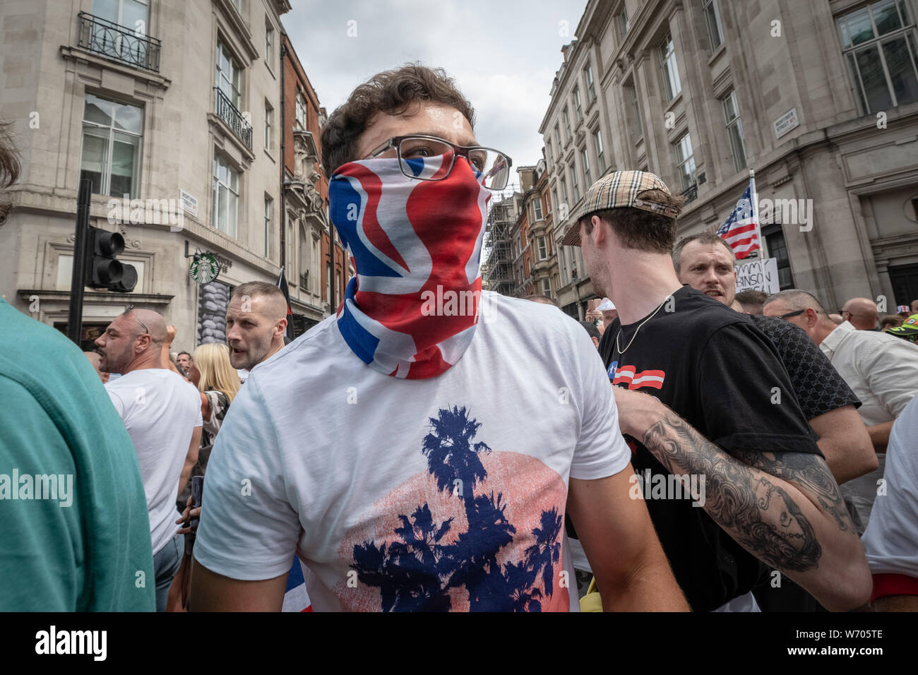 London, UK. 3rd August, 2019. 'Free Tommy Robinson' protest. Police arrest twenty four during a mass demonstration in support of the jailed Tommy Robinson, real name Stephen Yaxley-Lennon, who was sentenced last month to nine months in prison after being found guilty in contempt of court. Counter-protesters including antifascist activists and the anti-racist group: Stand Up to Racism, opposed the pro-Robinson demonstrators with protest groups kept apart by met police with some clashes. Credit: Guy Corbishley/Alamy Live News Stock Photo