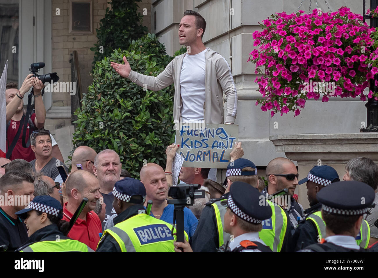 Danny Tommo (pictured) – real name Daniel Thomas, leads the 'Free Tommy Robinson' protest. Police arrest twenty four during a mass demonstration in support of the jailed Tommy Robinson, real name Stephen Yaxley-Lennon, who was sentenced last month to nine months in prison after being found guilty in contempt of court. Counter-protesters including antifascist activists and the anti-racist group: Stand Up to Racism, opposed the pro-Robinson demonstrators with protest groups kept apart by met police with some clashes. London, UK. Stock Photo