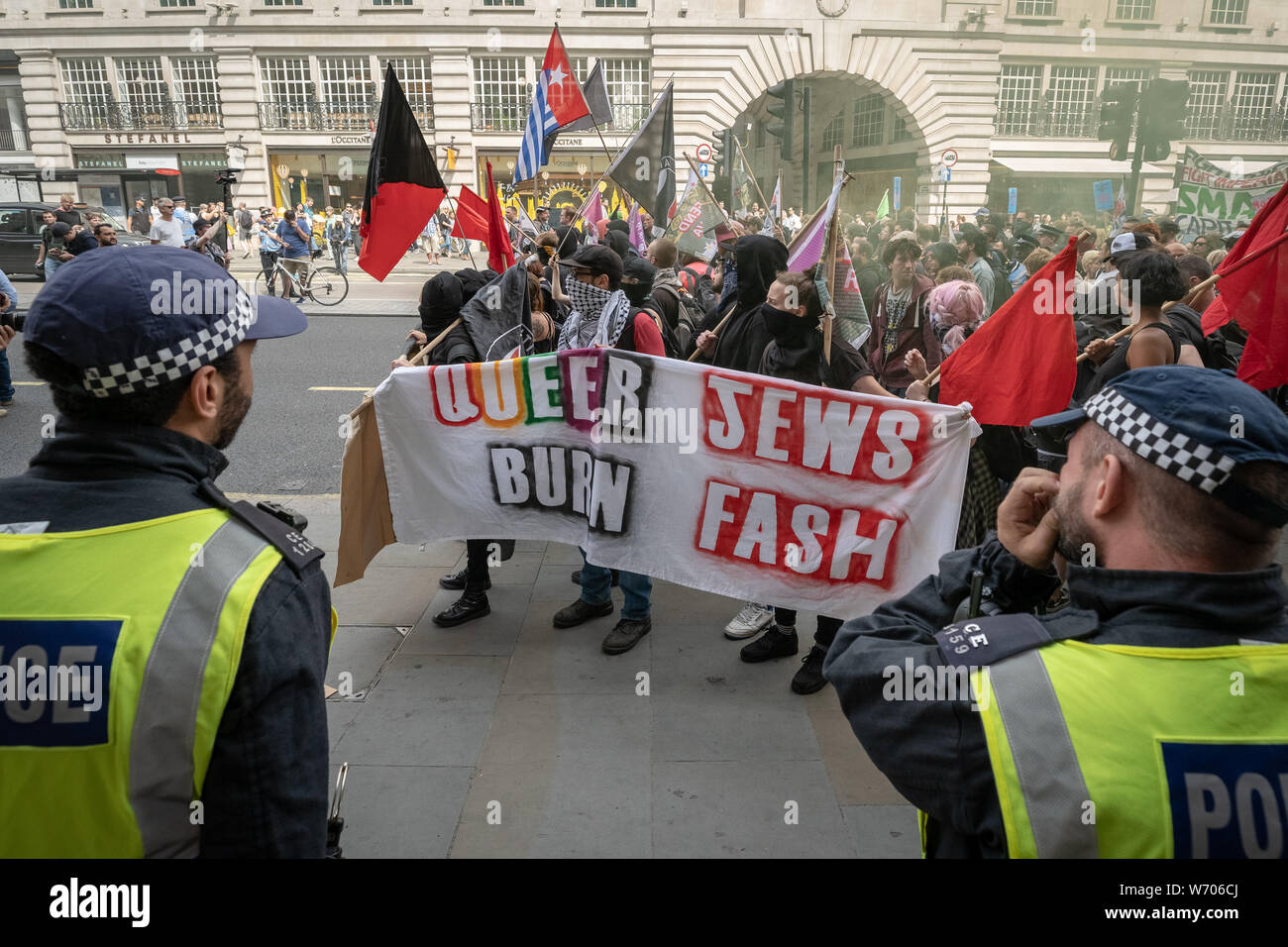 London, UK. 3rd August, 2019. Anti-fascists clash with police whilst counter-protesting the 'Free Tommy Robinson' demonstration. Police arrest twenty four during a mass demonstration in support of the jailed Tommy Robinson, real name Stephen Yaxley-Lennon, who was sentenced last month to nine months in prison after being found guilty in contempt of court. Counter-protesters including antifascist activists and the anti-racist group: Stand Up to Racism, opposed the pro-Robinson demonstrators with protest groups kept apart by met police. Credit: Guy Corbishley/Alamy Live News Stock Photo