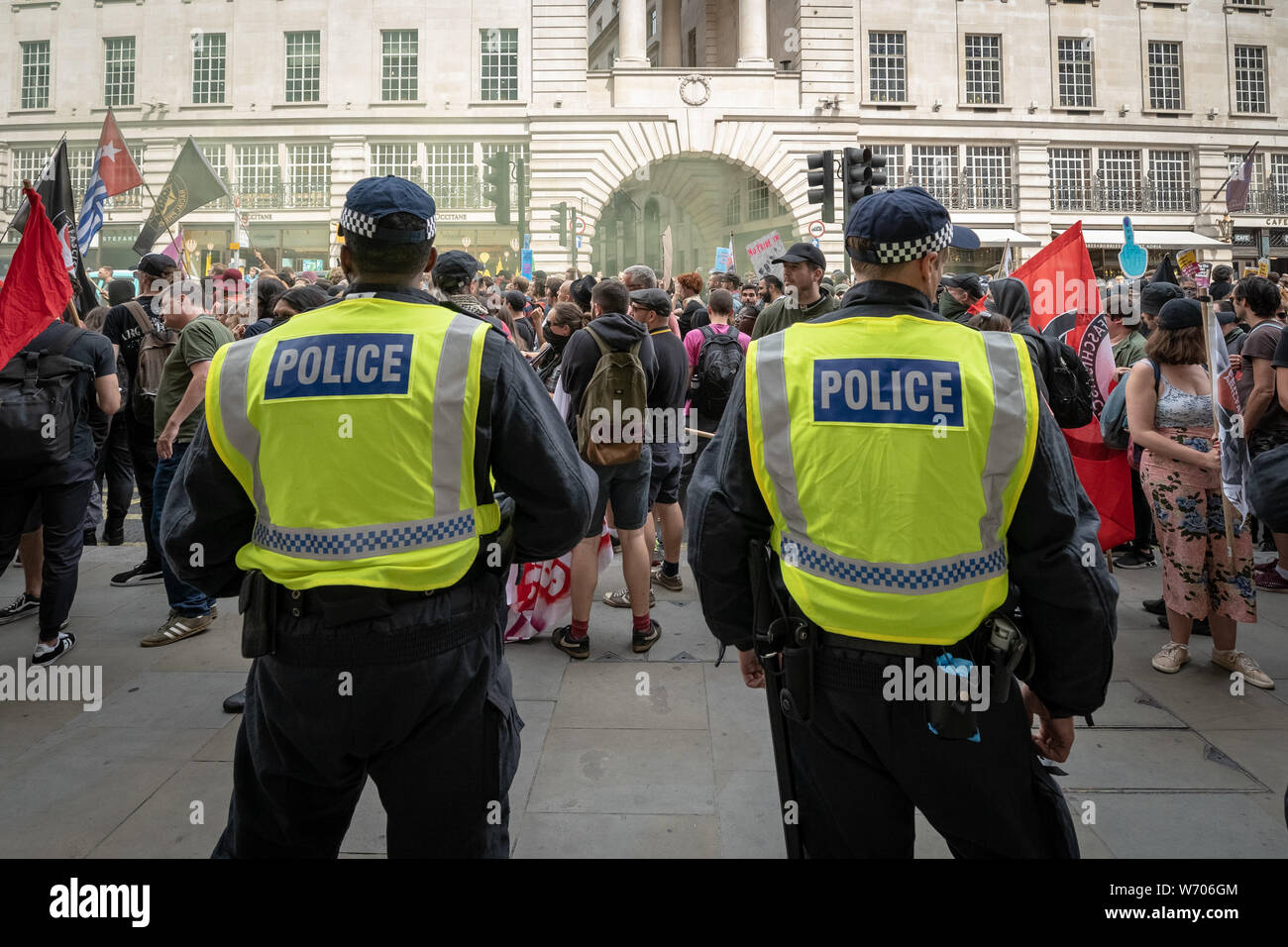 London, UK. 3rd August, 2019. Anti-fascists clash with police whilst counter-protesting the 'Free Tommy Robinson' demonstration. Police arrest twenty four during a mass demonstration in support of the jailed Tommy Robinson, real name Stephen Yaxley-Lennon, who was sentenced last month to nine months in prison after being found guilty in contempt of court. Counter-protesters including antifascist activists and the anti-racist group: Stand Up to Racism, opposed the pro-Robinson demonstrators with protest groups kept apart by met police. Credit: Guy Corbishley/Alamy Live News Stock Photo