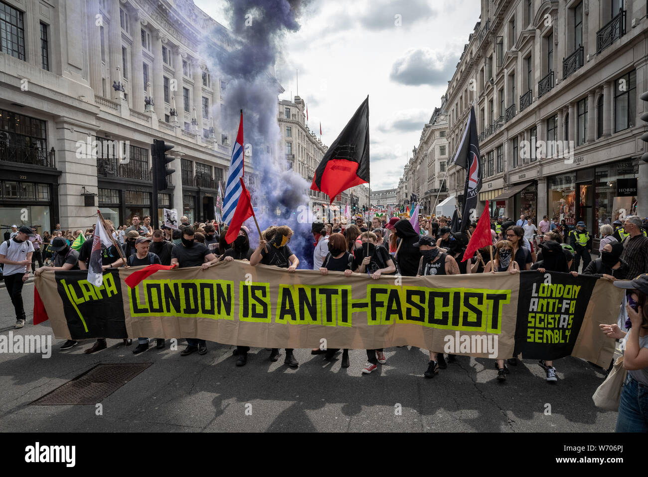 London, UK. 3rd August, 2019. Anti-fascists clash with police whilst counter-protesting the 'Free Tommy Robinson' demonstration. Police arrest twenty four during a mass demonstration in support of the jailed Tommy Robinson, real name Stephen Yaxley-Lennon, who was sentenced last month to nine months in prison after being found guilty in contempt of court. Counter-protesters including antifascist activists and the anti-racist group: Stand Up to Racism, opposed the pro-Robinson demonstrators with protest groups kept apart by met police. Credit: Guy Corbishley/Alamy Live News Stock Photo