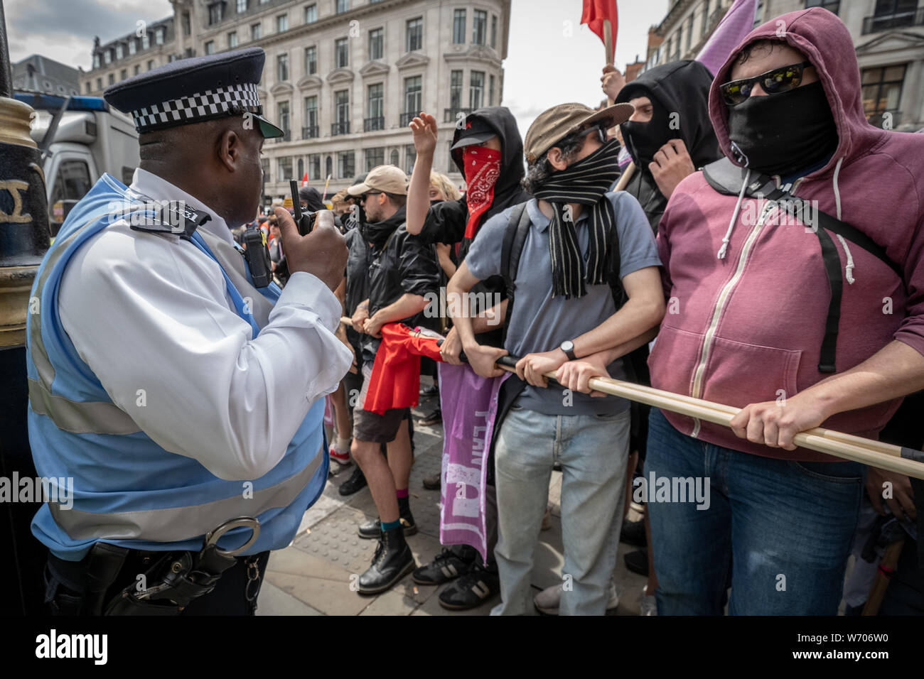 London, UK. 3rd August, 2019. Anti-fascists clash with police whilst counter-protesting the 'Free Tommy Robinson' demonstration. Police arrest twenty four during a mass demonstration in support of the jailed Tommy Robinson, real name Stephen Yaxley-Lennon, who was sentenced last month to nine months in prison after being found guilty in contempt of court. Counter-protesters including antifascist activists and the anti-racist group: Stand Up to Racism, opposed the pro-Robinson demonstrators with protest groups kept apart by met police. Credit: Guy Corbishley/Alamy Live News Stock Photo