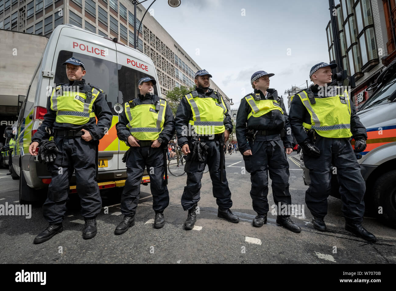 London, UK. 3rd August, 2019. Anti-fascists clash with police whilst counter-protesting the 'Free Tommy Robinson' demonstration. Police arrest twenty four during a mass demonstration in support of the jailed Tommy Robinson, real name Stephen Yaxley-Lennon, who was sentenced last month to nine months in prison after being found guilty in contempt of court. Counter-protesters including antifascist activists and the anti-racist group: Stand Up to Racism, opposed the pro-Robinson demonstrators with protest groups kept apart by met police. Credit: Guy Corbishley/Alamy Live News Stock Photo