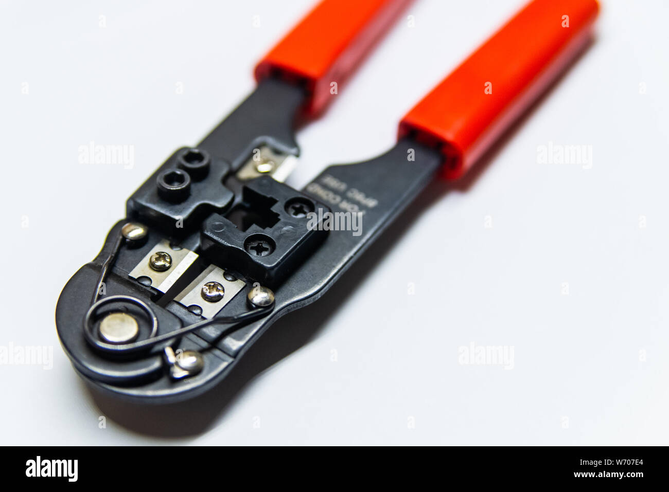 Modular crimping tool isolated on white background. Stock Photo