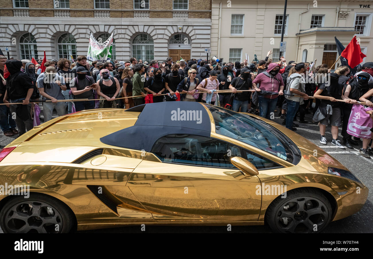 London, UK. 3rd August, 2019. Anti-fascists clash with police whilst counter-protesting the 'Free Tommy Robinson' demonstration. Police arrest twenty four during a mass demonstration in support of the jailed Tommy Robinson, real name Stephen Yaxley-Lennon, who was sentenced last month to nine months in prison after being found guilty in contempt of court. Counter-protesters including antifascist activists and the anti-racist group: Stand Up to Racism, opposed the pro-Robinson demonstrators with protest groups kept apart by met police. Credit: Guy Corbishley/Alamy Live News Stock Photo