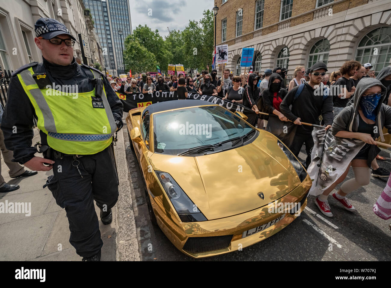 London, UK. 3rd August, 2019. Anti-fascists clash with police whilst counter-protesting the 'Free Tommy Robinson' demonstration. Police arrest twenty four during a mass demonstration in support of the jailed Tommy Robinson, real name Stephen Yaxley-Lennon, who was sentenced last month to nine months in prison after being found guilty in contempt of court. Counter-protesters including antifascist activists and the anti-racist group: Stand Up to Racism, opposed the pro-Robinson demonstrators with protest groups kept apart by met police. Credit: Guy Corbishley/Alamy Live News Stock Photo