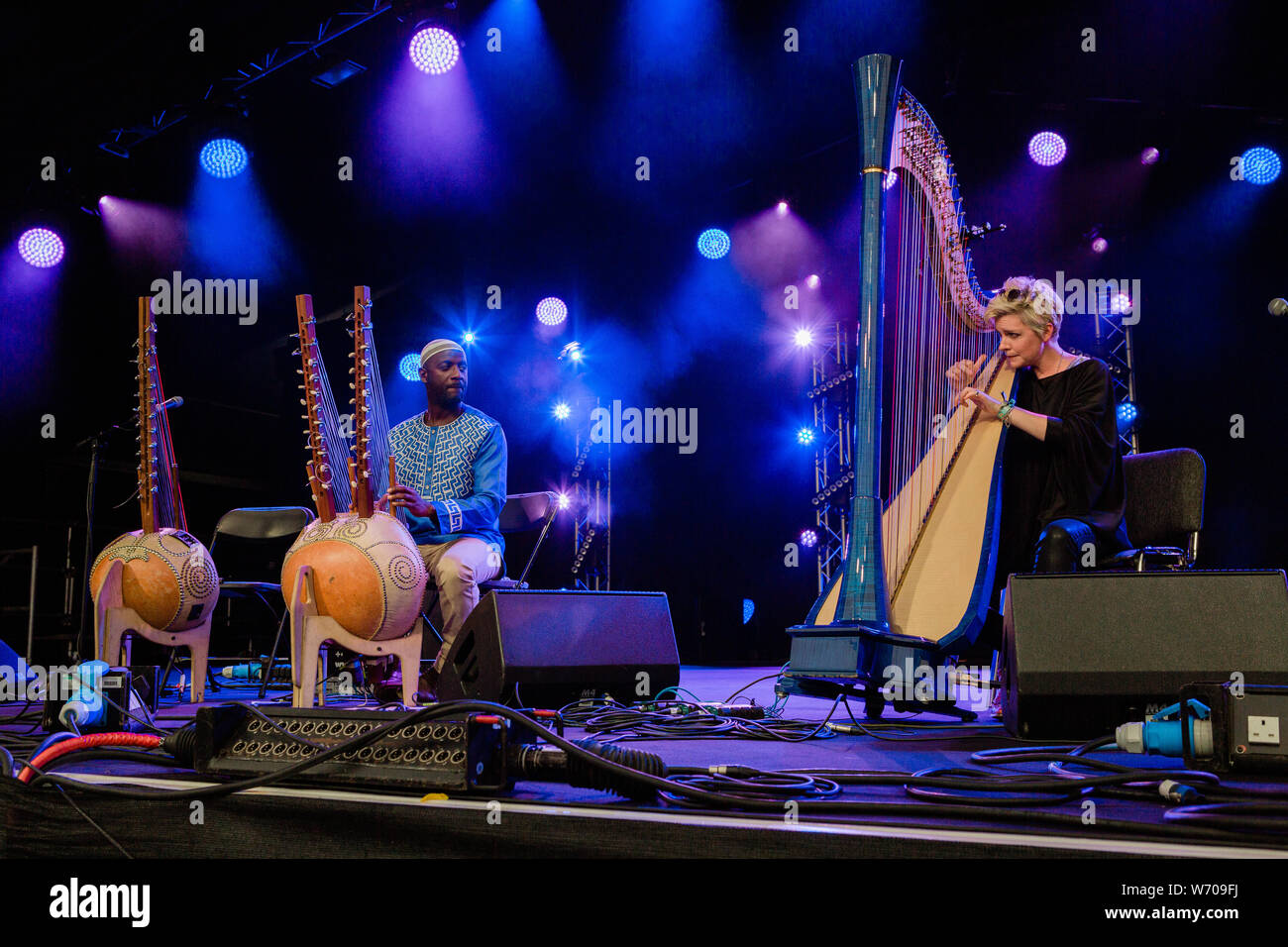 Cambridge, UK. 3rd August 2019. Welsh harpist Catrin Finch and Senegalese kora player Seckou Keita performs at Stage 1 during the Cambridge Folk Festival. Richard Etteridge / Alamy Live News Stock Photo