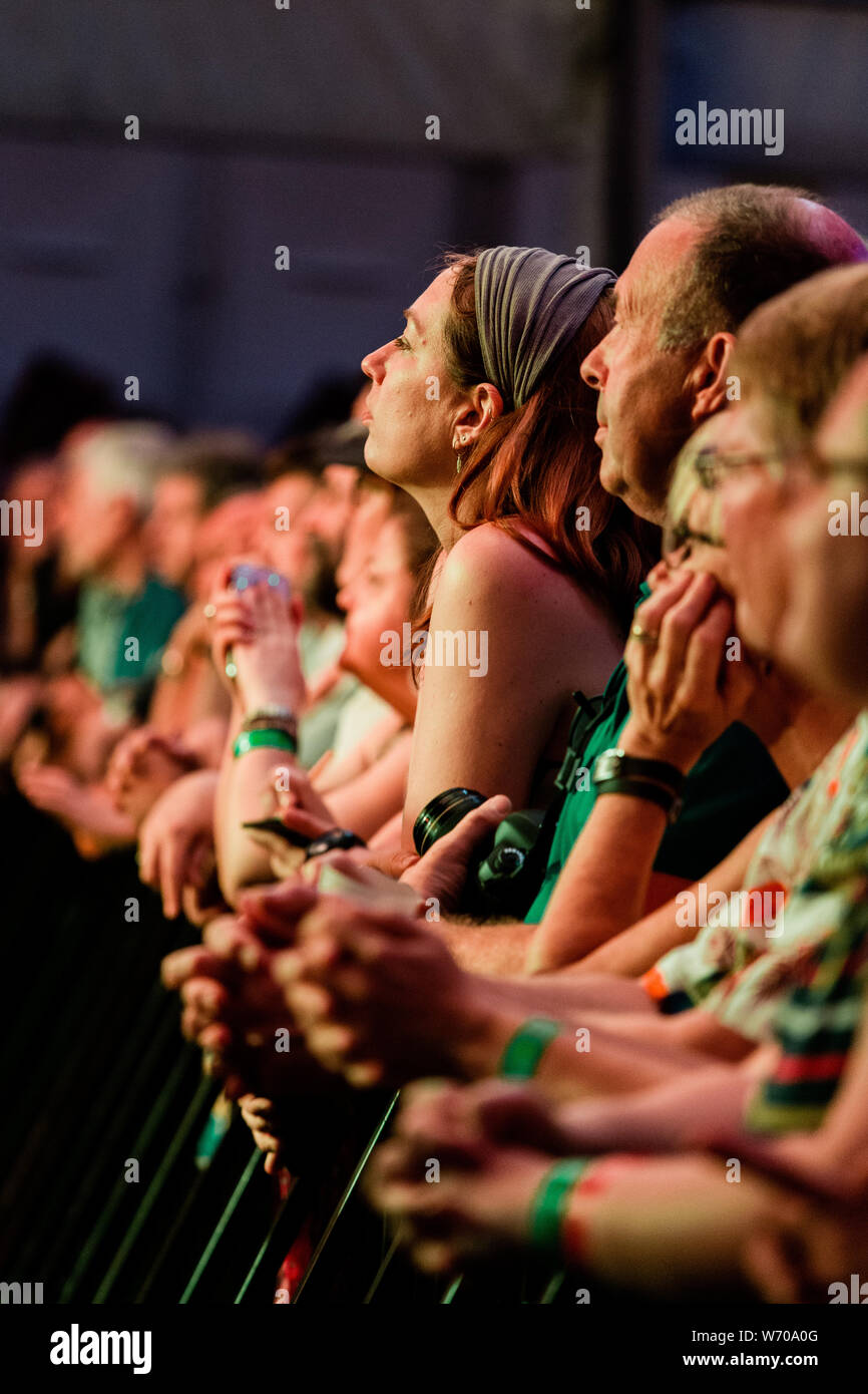 Cambridge, UK. 3rd August 2019. Crowds watch Lucinda Williams perform at Stage 1 during the Cambridge Folk Festival. Richard Etteridge / Alamy Live News Stock Photo