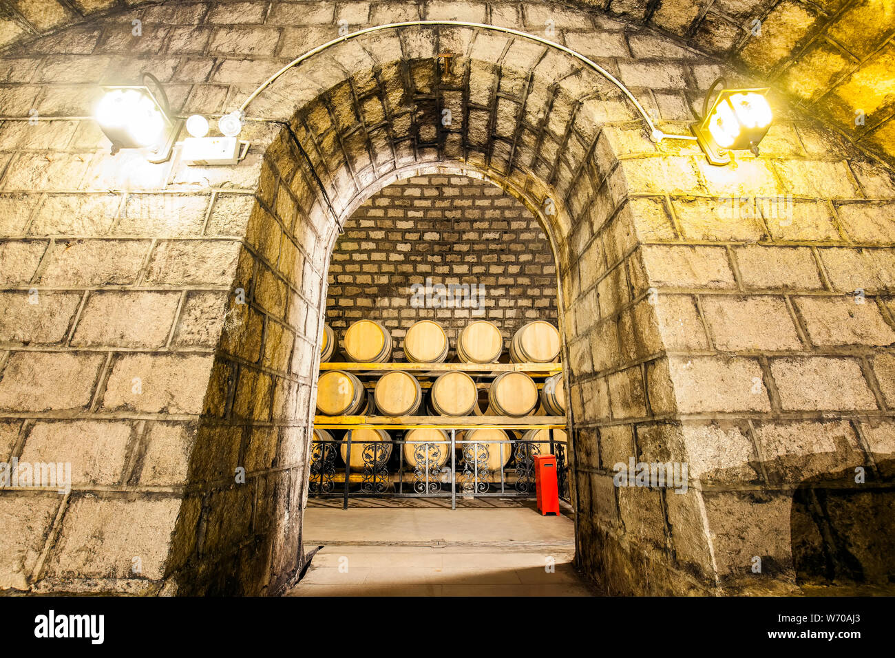 Wine barrels stacked in the cellar of the winery Stock Photo Alamy