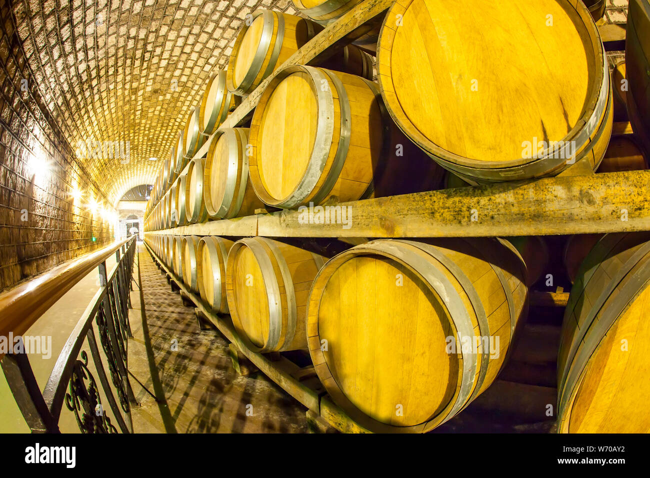 Wine barrels stacked in the cellar of the winery Stock Photo Alamy