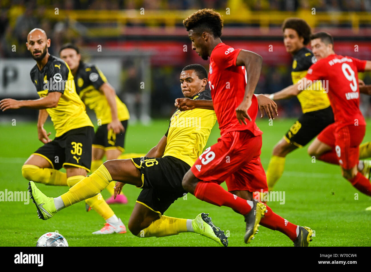 Manuel Akanji from Borussia Dortmund (L) and Kingsley Coman from Bayern Munich (R) are seen in action during the Germany Supercup Final 2019 match between Borussia Dortmund and Bayern Munich.(Final score: Borussia Dortmund 2:0 Bayern Munich) Stock Photo