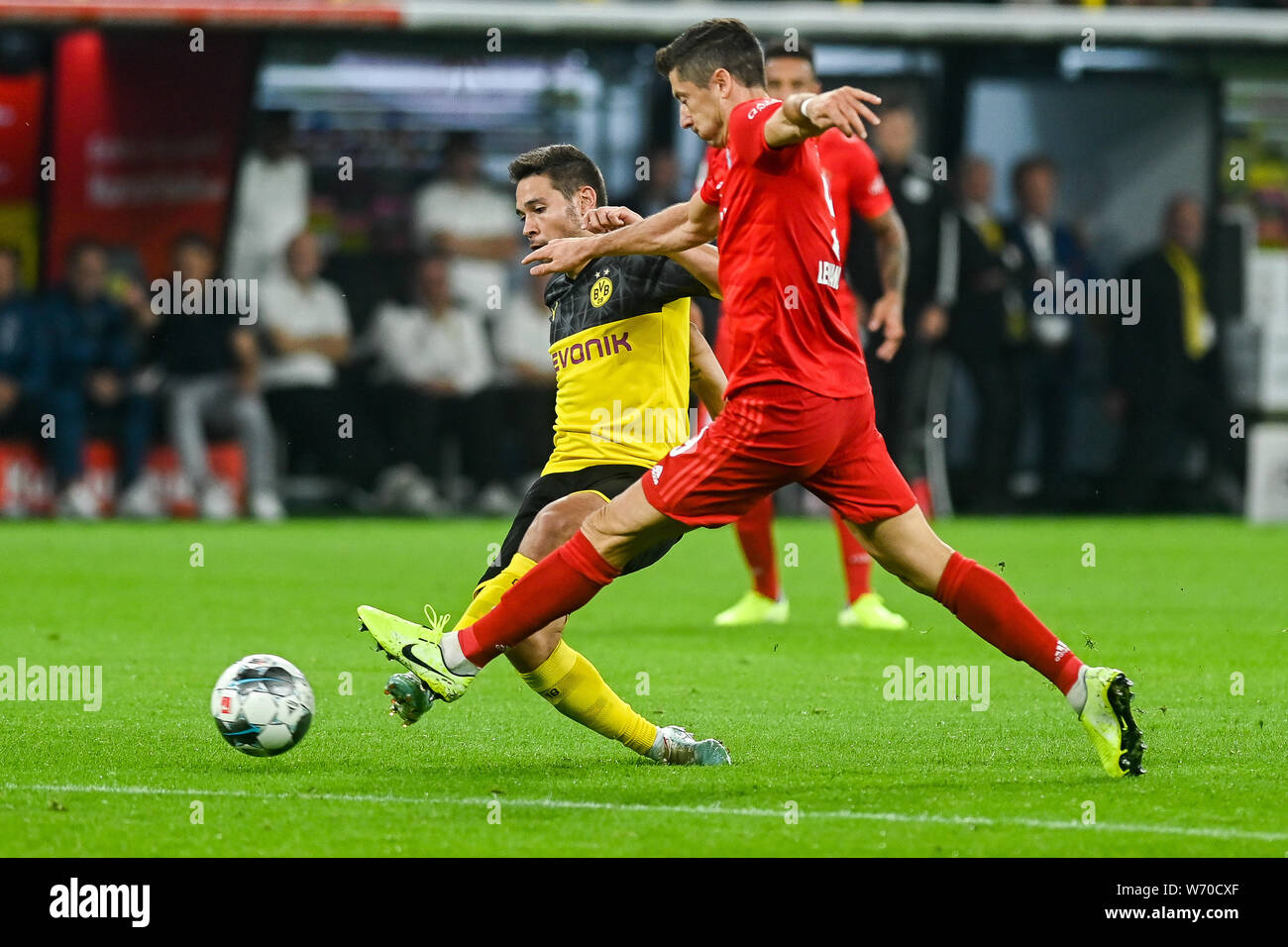 Raphael Guerreiro from Borussia Dortmund (L) and Robert Lewandowski from Bayern Munich (R) are seen in action during the Germany Supercup Final 2019 match between Borussia Dortmund and Bayern Munich.(Final score: Borussia Dortmund 2:0 Bayern Munich) Stock Photo