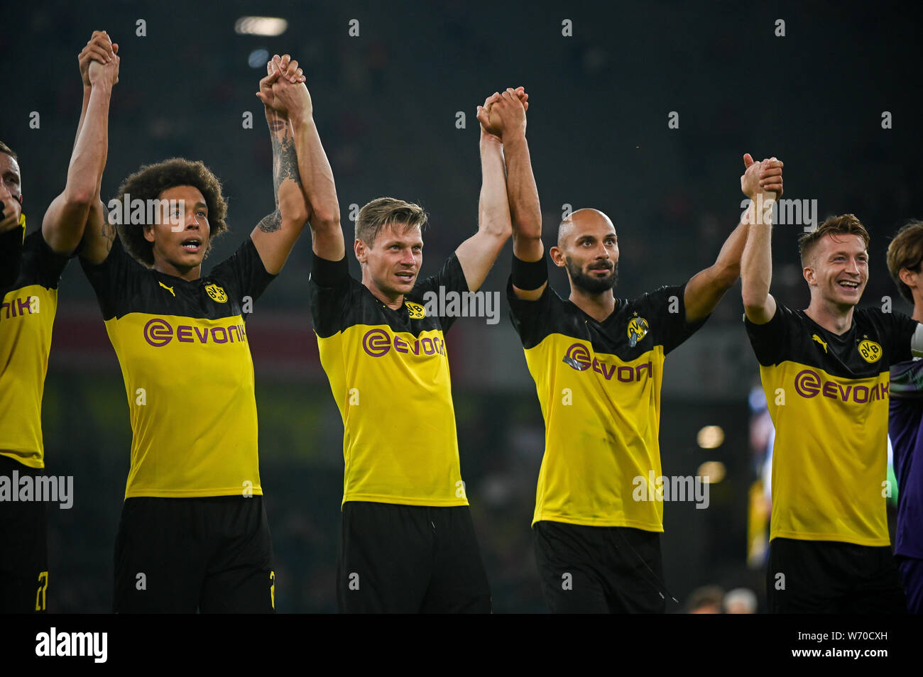 Axel Witsel, Lukasz Piszczek, Omer Toprak and Marco Reus from Borussia Dortmund are seen after winning the Germany Supercup Final 2019 match between Borussia Dortmund and Bayern Munich. Stock Photo