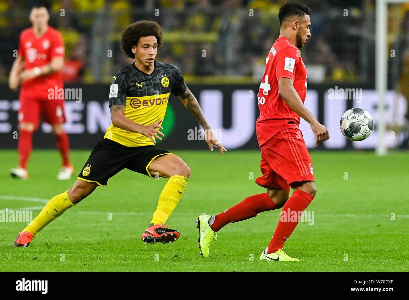 Axel Witsel from Borussia Dortmund (L) and Corentin Tolisso from Bayern Munich (R) are seen in action during the Germany Supercup Final 2019 match between Borussia Dortmund and Bayern Munich.(Final score: Borussia Dortmund 2:0 Bayern Munich) Stock Photo