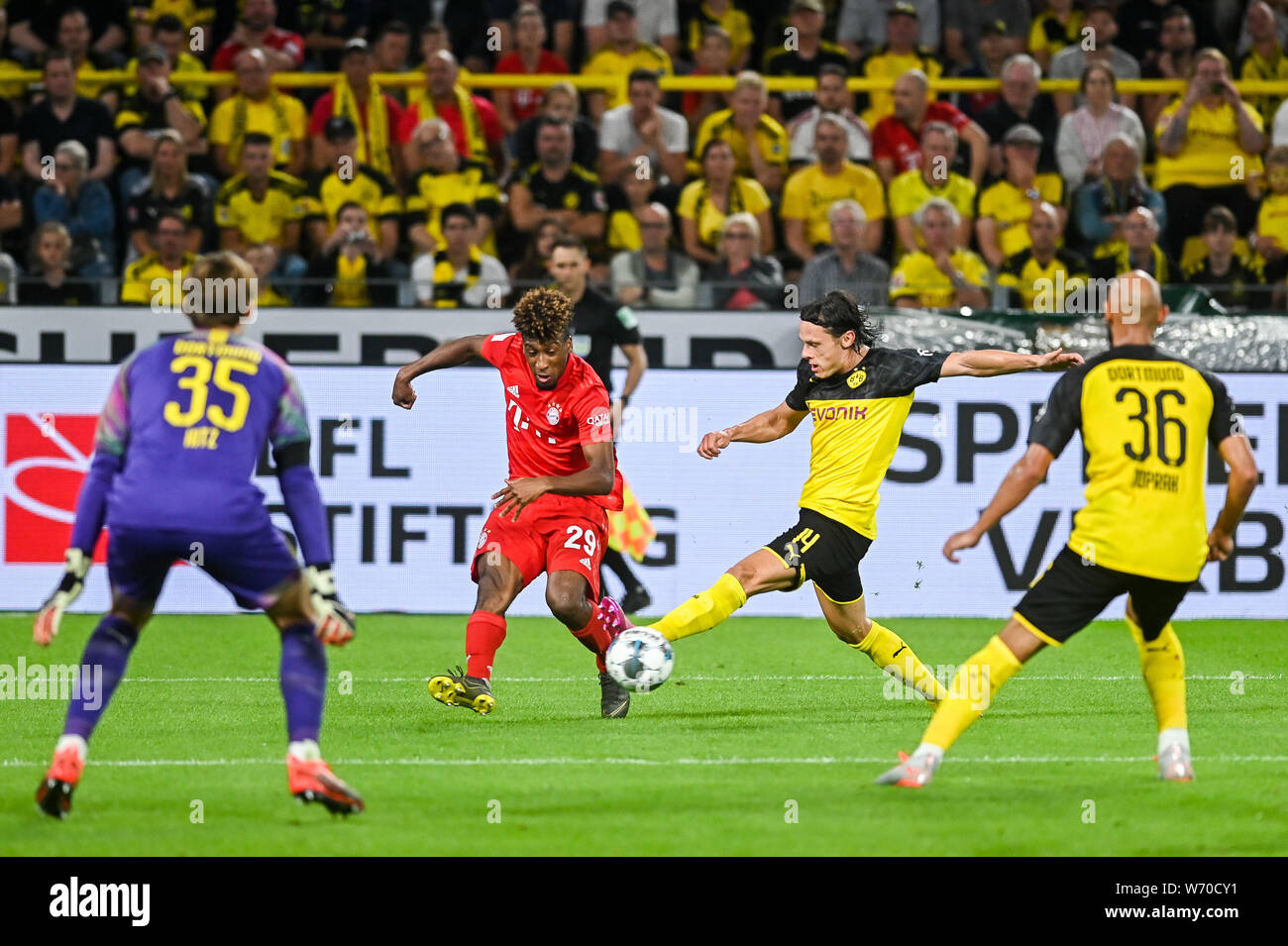 Kingsley Coman from Bayern Munich (L) and Nico Schulz from Borussia Dortmund (R) are seen in action during the Germany Supercup Final 2019 match between Borussia Dortmund and Bayern Munich.(Final score: Borussia Dortmund 2:0 Bayern Munich) Stock Photo