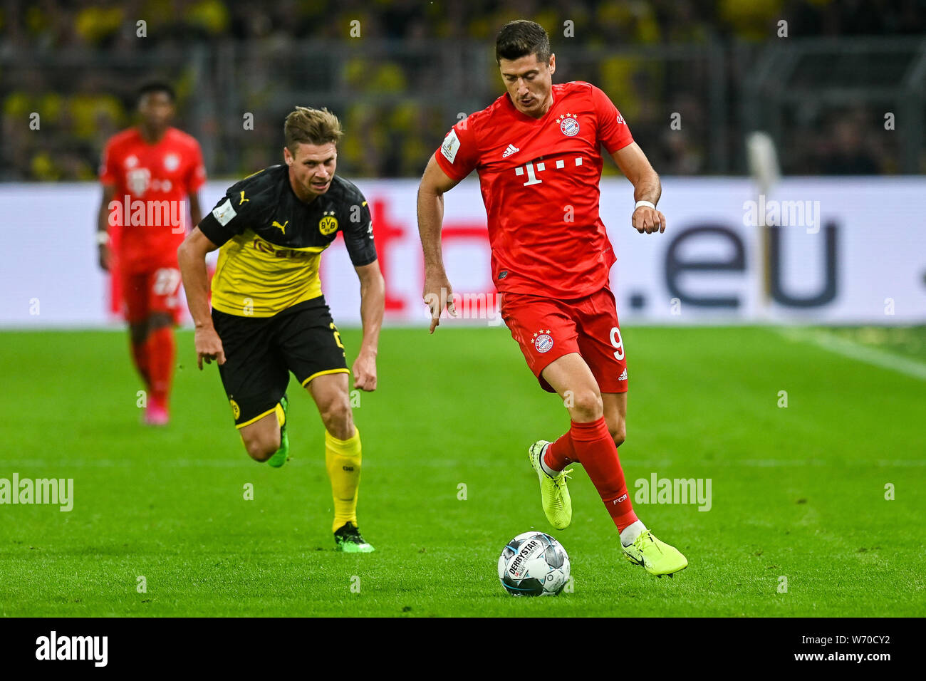 Lukasz Piszczek from Borussia Dortmund (L) and Robert Lewandowski from Bayern Munich (R) are seen in action during the Germany Supercup Final 2019 match between Borussia Dortmund and Bayern Munich.(Final score: Borussia Dortmund 2:0 Bayern Munich) Stock Photo