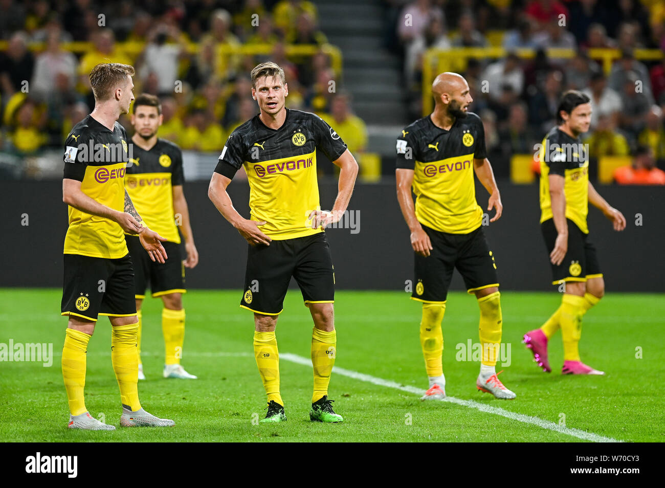 Marco Reus from Borussia Dortmund (L) and Lukasz Piszczek from Borussia Dortmund (R) are seen in action during the Germany Supercup Final 2019 match between Borussia Dortmund and Bayern Munich.(Final score: Borussia Dortmund 2:0 Bayern Munich) Stock Photo
