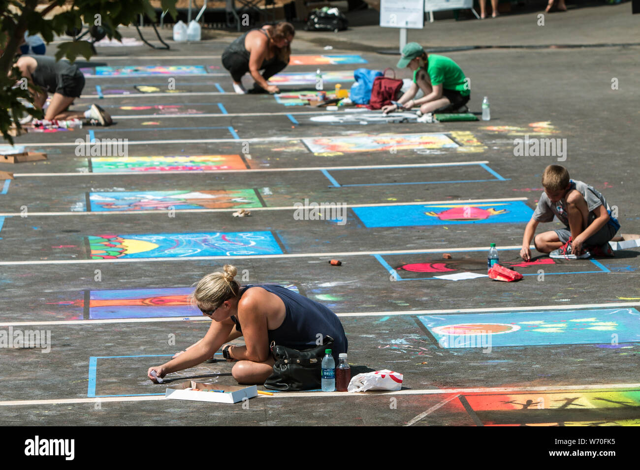 Sandy Springs, GA, USA September 22, 2018 People draw chalk art on