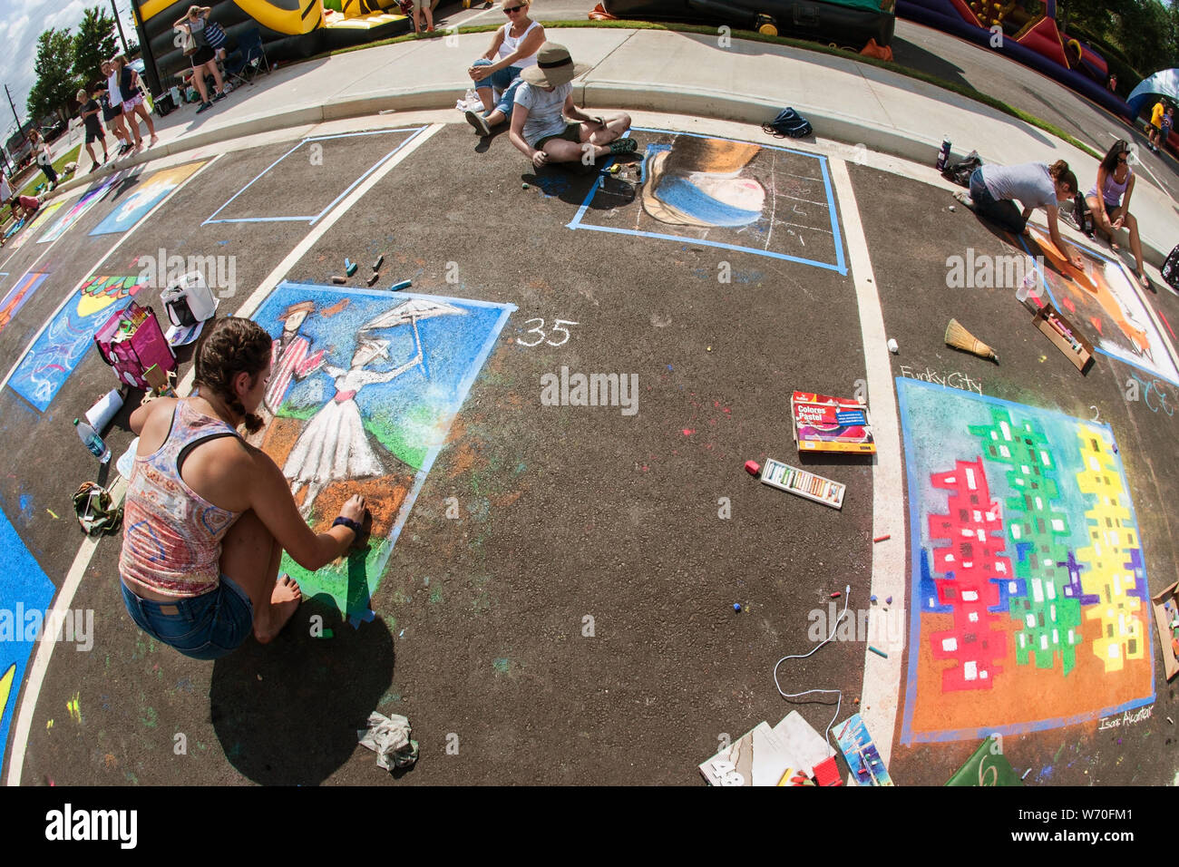 Sandy Springs, GA, USA September 22, 2018 Teenage girls draw chalk