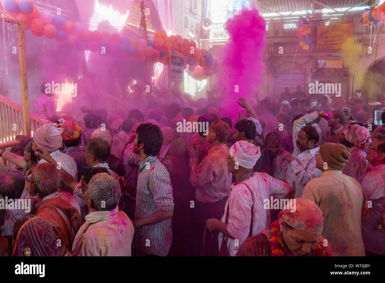 People offering Prayers at Barsana Temple during Holi Celebrations at Mathura,Uttarpradesh,India,Asia Stock Photo