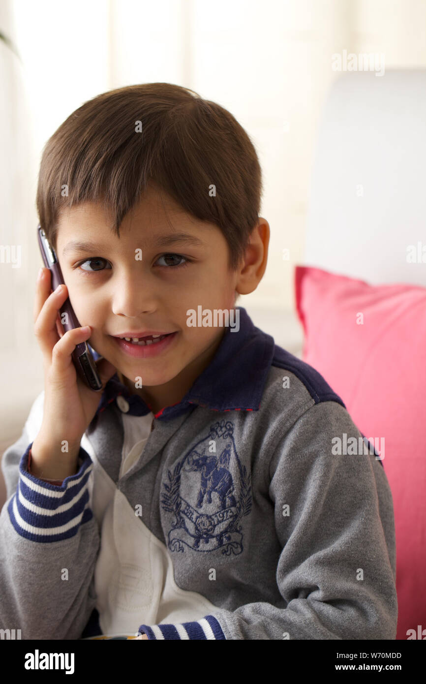 Boy talking on mobile phone Stock Photo