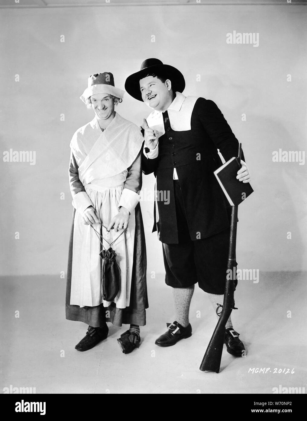 STAN LAUREL as Priscilla ALDEN and OLIVER HARDY as John Alden Publicity Still circa 1930 MAYFLOWER PILGRIMS Hal Roach Studios / Metro Goldwyn Mayer Stock Photo