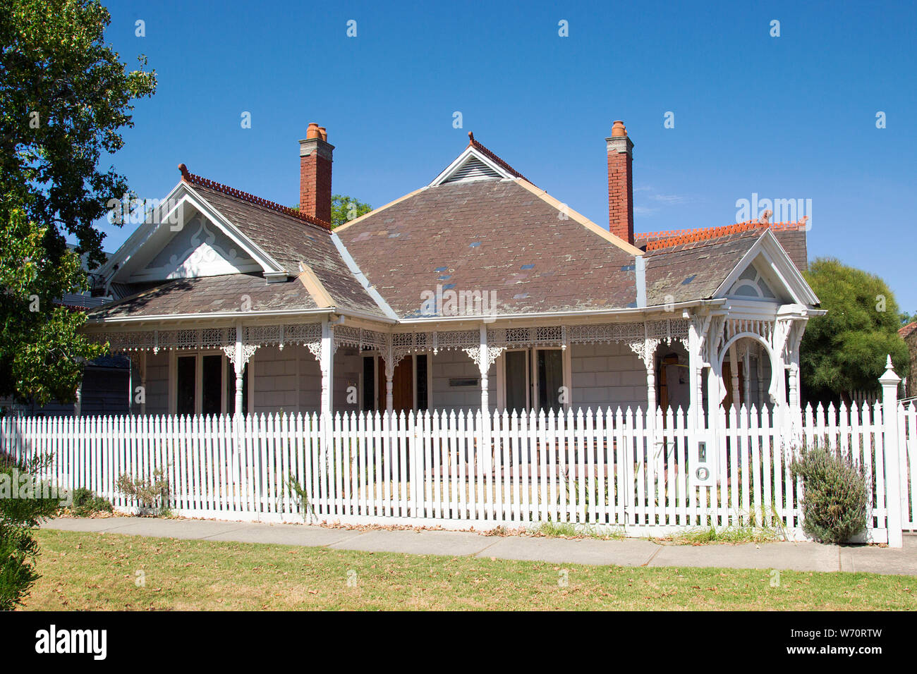 Williamstown, Australia: March, 2019: Traditionally built bungalow in the 20th century Australian style with a porch, verandah and picket fence. Stock Photo