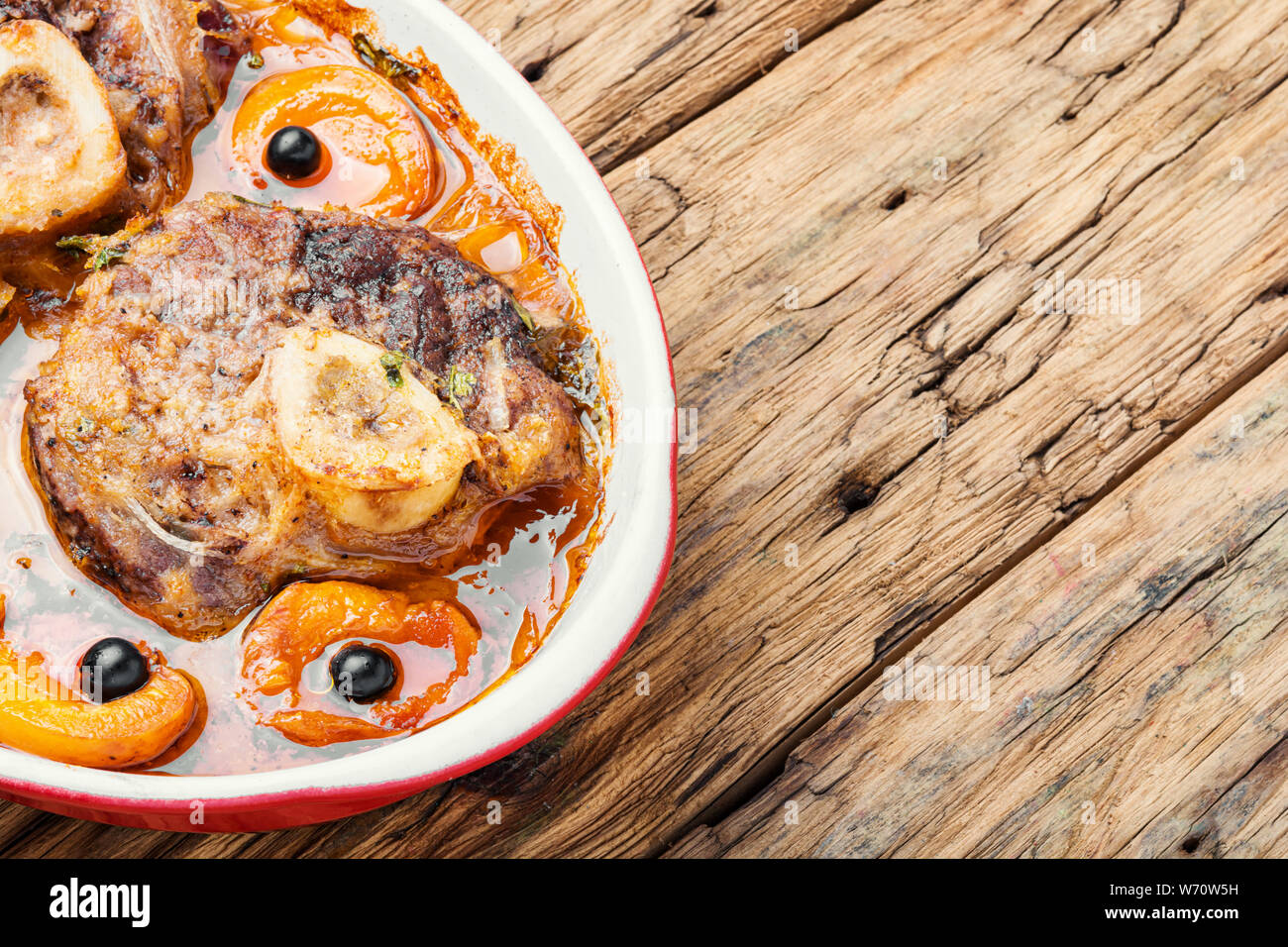 Ossobuco, traditional dish of Italian cuisine. Stewed veal leg.Italian