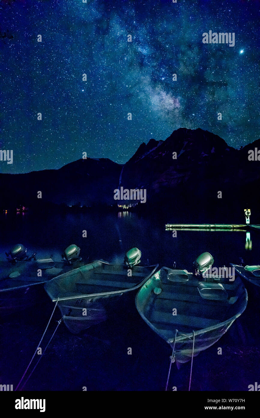 starry night sky with milky way, mountains, and boats Stock Photo - Alamy