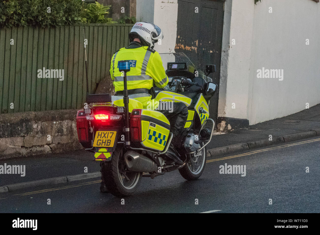 a police motorcyclist rider on a law enforcement machine or motorbike. Stock Photo